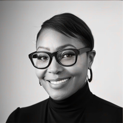 Nickey Lemley, CEO of MUR Solutions, styled with a sleek pixie haircut and donning eyeglasses.